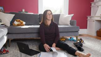 Student sitting in front of couch